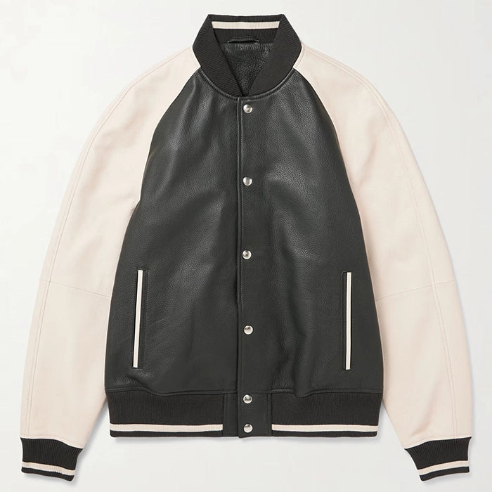 Laid flat black leather varsity jacket with beige sleeves.