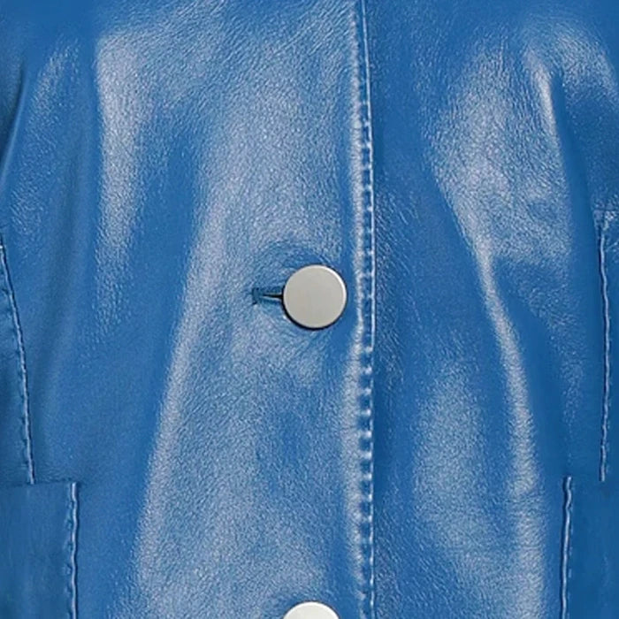 Close-up of a blue women jacket with a button