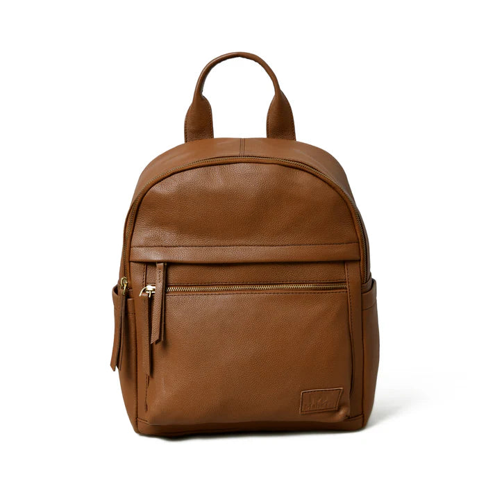 A light brown, top-grain buffalo leather backpack with a sleek, minimalist design featuring multiple zippered pockets and a sturdy handle.