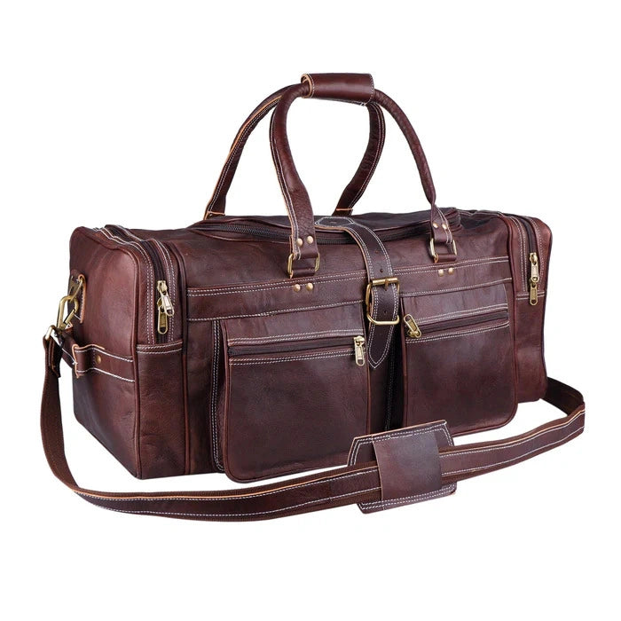 Brown leather duffel bag with gold hardware on a white background