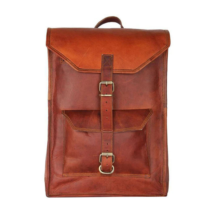 A vintage-inspired brown leather rucksack with adjustable padded leather shoulder straps and a front pocket with buckle closure.