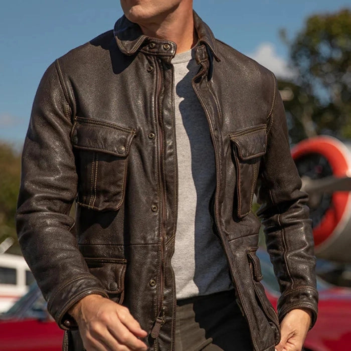 Person wearing a Brown stonewashed leather jacket with multiple pockets