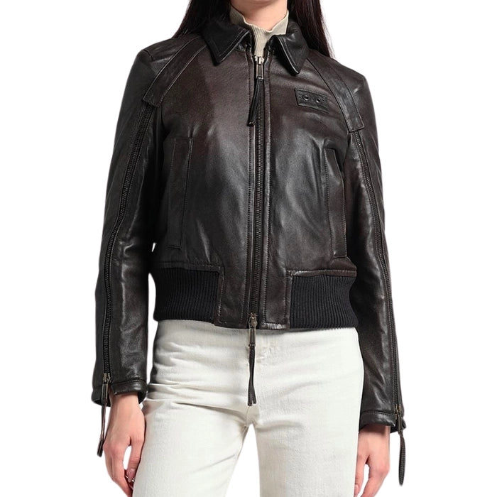 Side angle of model wearing brown bomber jacket with zipper closure